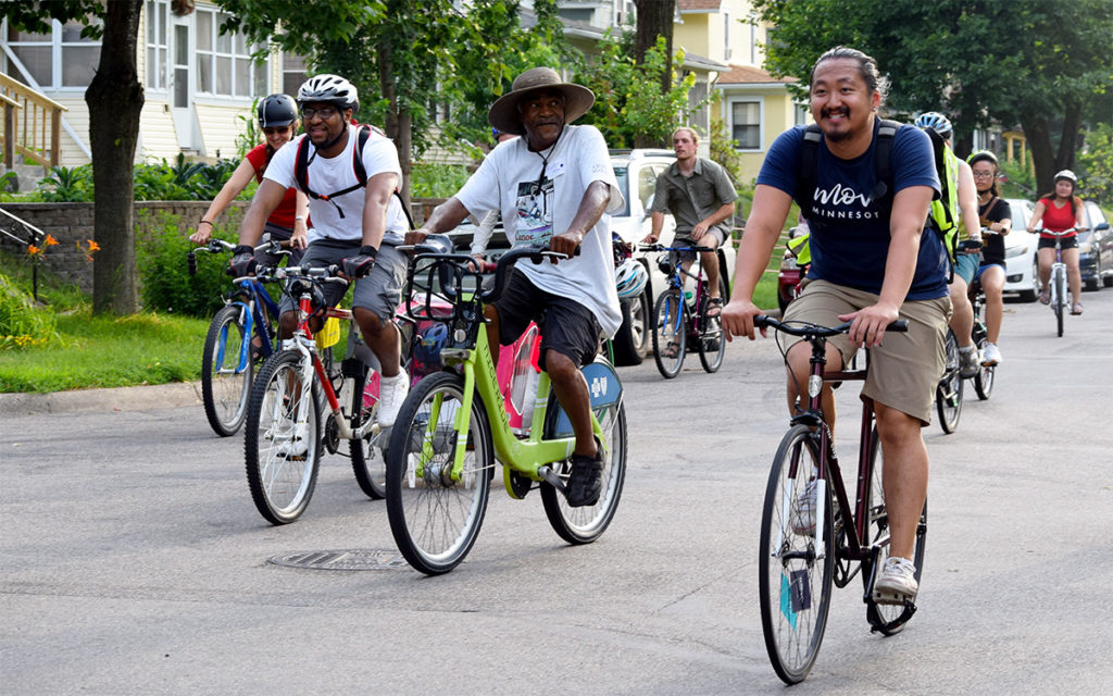 Move Minnesota staff leading a bike ride with community members