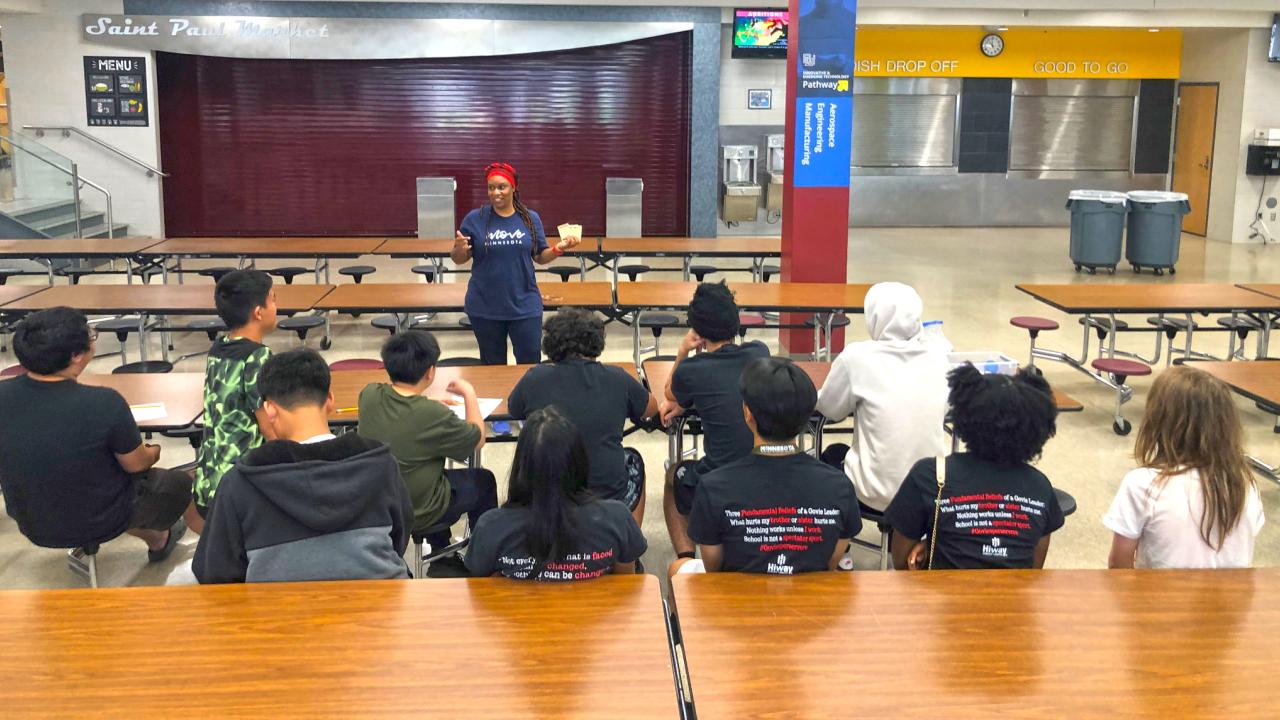 Move Minnesota program manager Theresa Thompson Nix talks to high schools students during a school visit in Saint Paul, MN.
