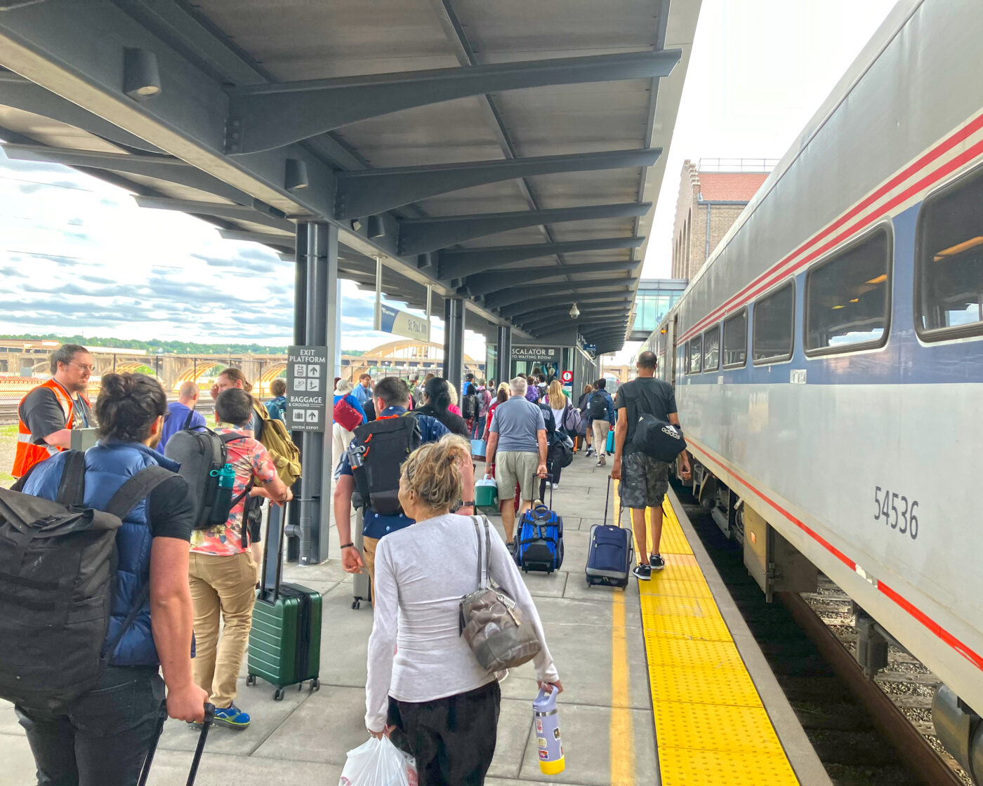 Many people with luggage on the Amtrak Borealis train platform in Saint Paul