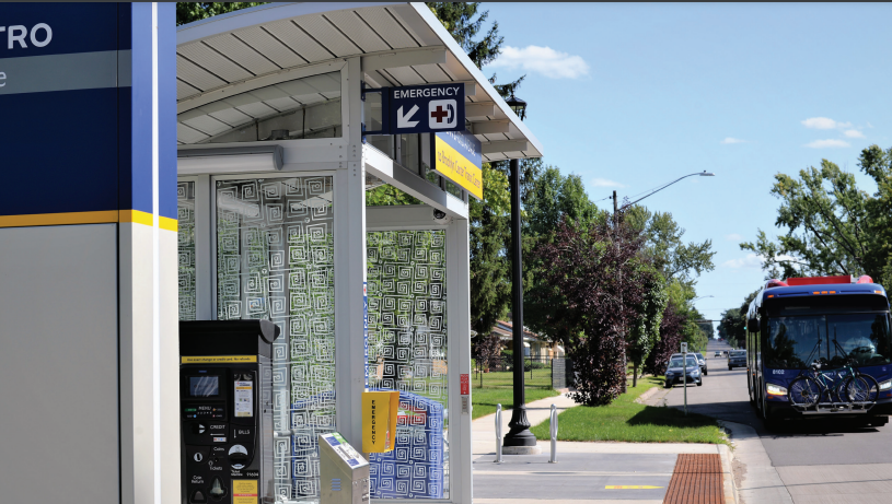 An image of a bus approaching a bus stop