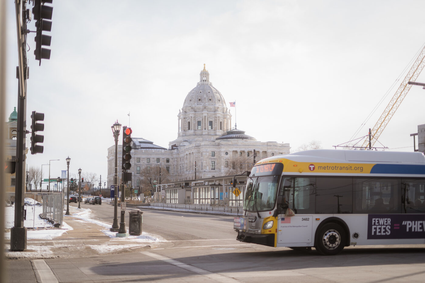 A Metro Transit bus crossing an intersection near the State Capitol on a winter day